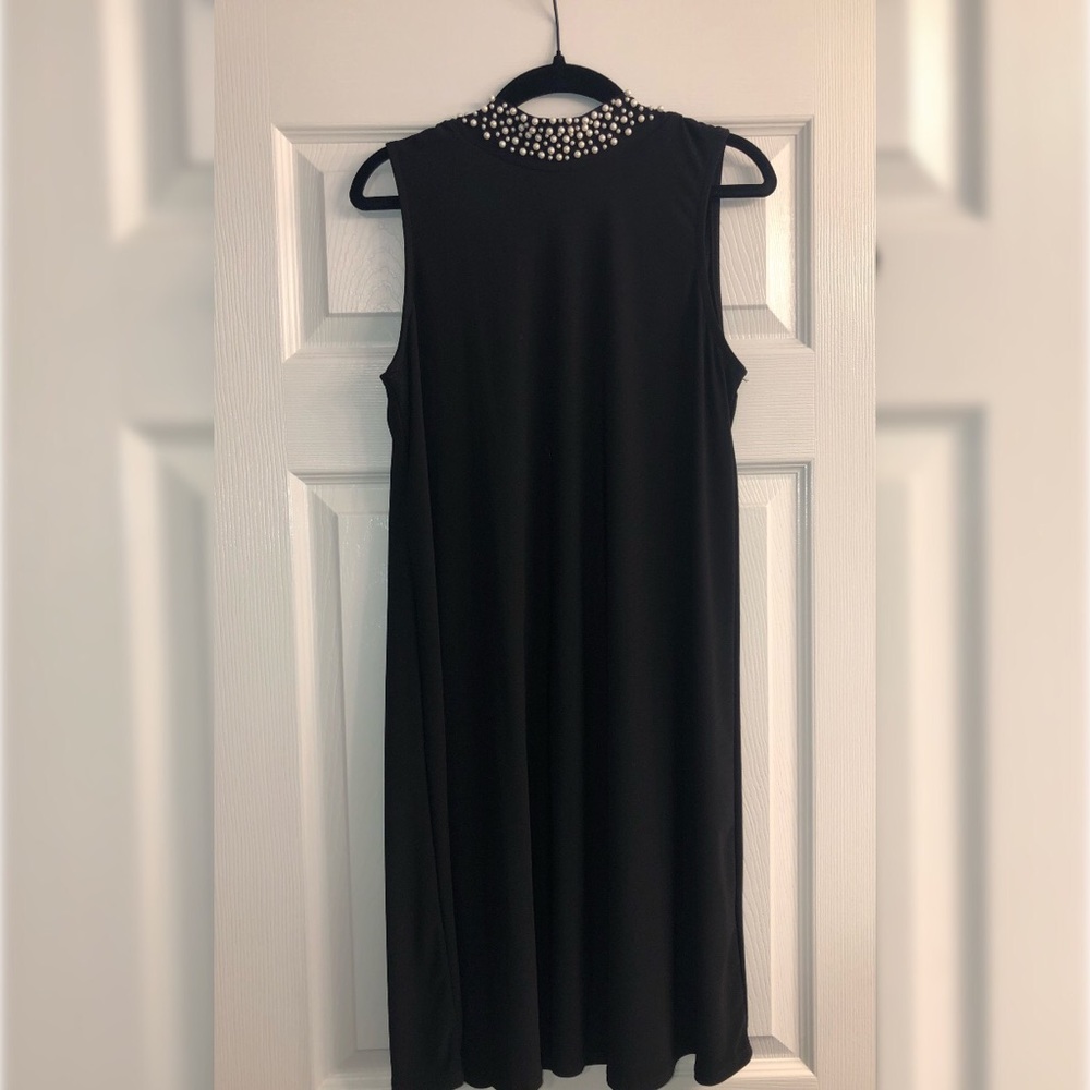 Mini black dress with pearl neck detail